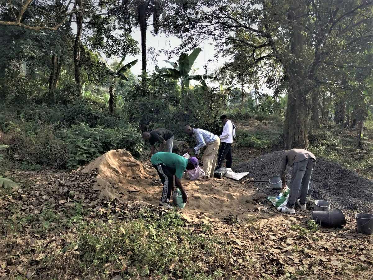 Men digging in forest for sand and gravel